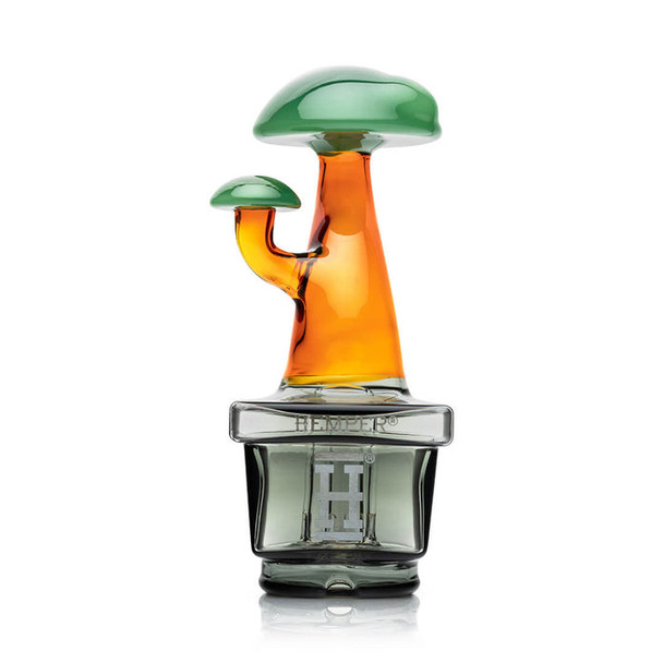 Clean studio shot of Zen Bonsai Puffco Peak top, green canopy and amber stem over smoked base, shop accessory