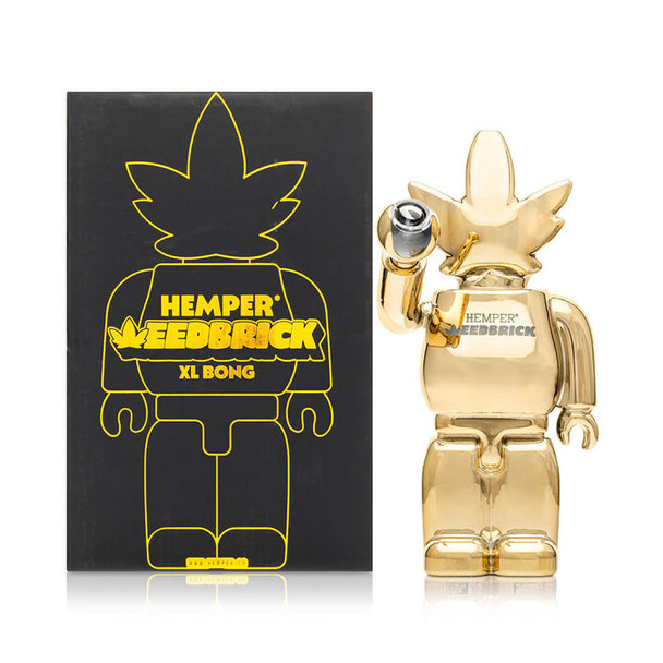 Hemper Weedbrick XL box beside gold character bong, shelf-ready wholesale smoke shop display presentation
