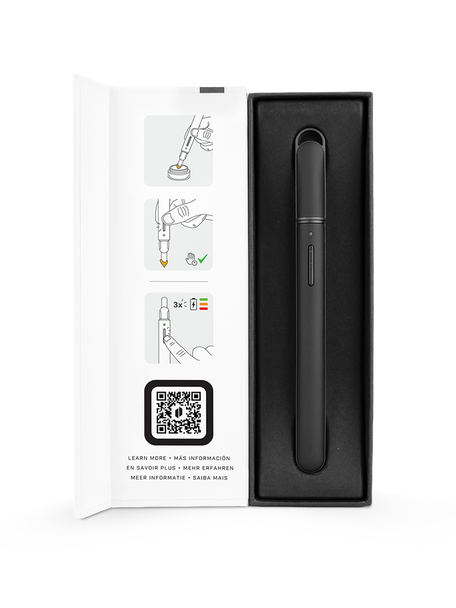 Open-box Puffco heated loading tool for smoke shop resale, black unit in tray with quick-start graphics