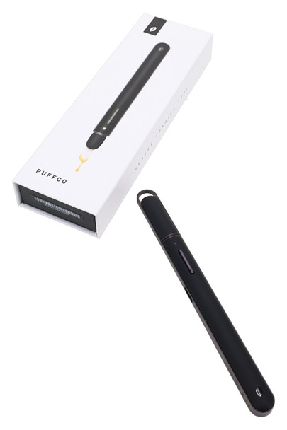 Boxed Puffco heated loading tool for vape accessory resale, black unit with retail packaging at angled view