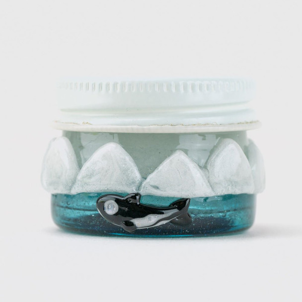 1.5" blue Arctic terp jar for wholesale retail smoke gear, rear view with sculpted orca detail