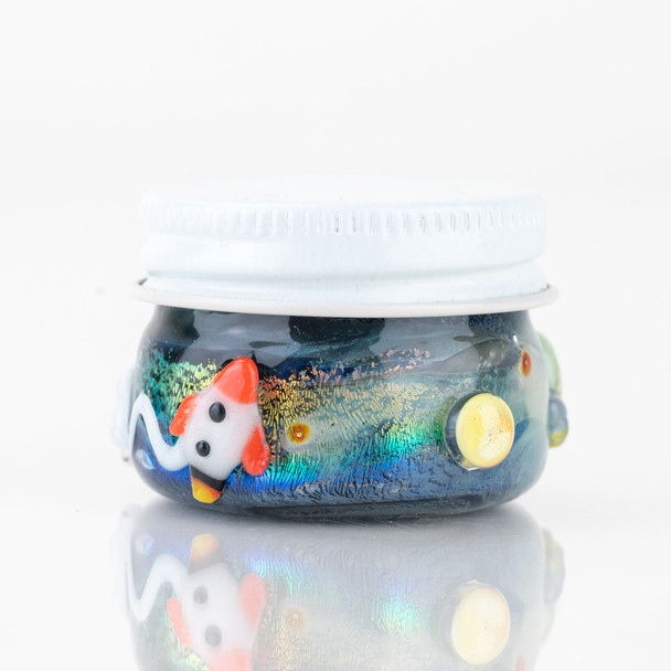 Glow-style 1.5" cosmic terp jar for wholesale retail smoke gear, side view with space artwork