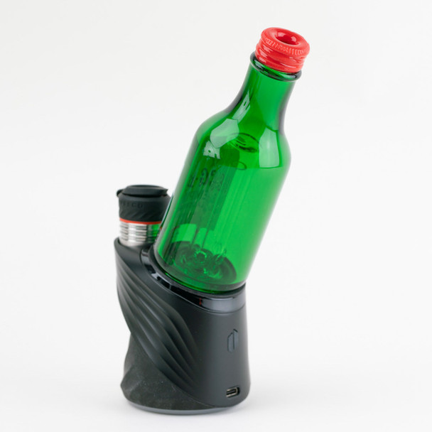 Rear angle green bottle Puffco Peak attachment for wholesale head-shop supplies on black base