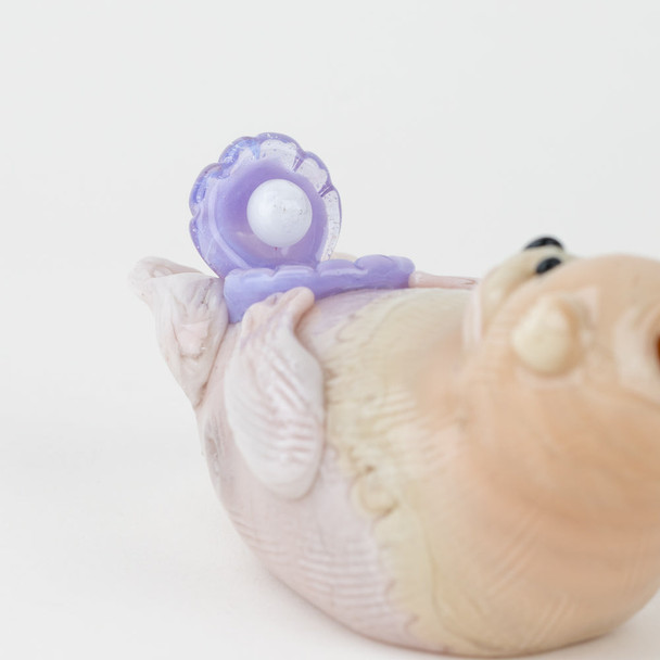 Empire Glassworks otter hand pipe displayed to highlight sculpted body and compact 4" size