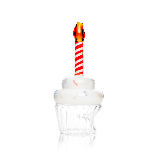Angled side view of Hemper cupcake glass hand pipe with sprinkle frosting and striped candle stem