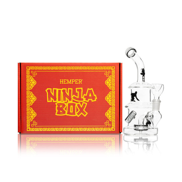 Hemper Ninja Bong displayed beside branded Ninja Box retail packaging with themed red and gold artwork