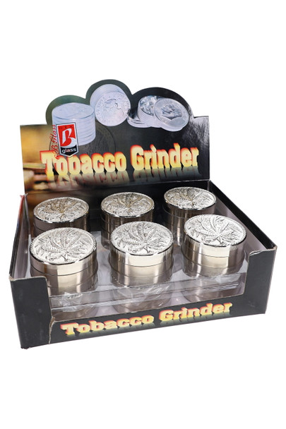 2" leaf design metal grinder shown closed with decorative top artwork for retail displays