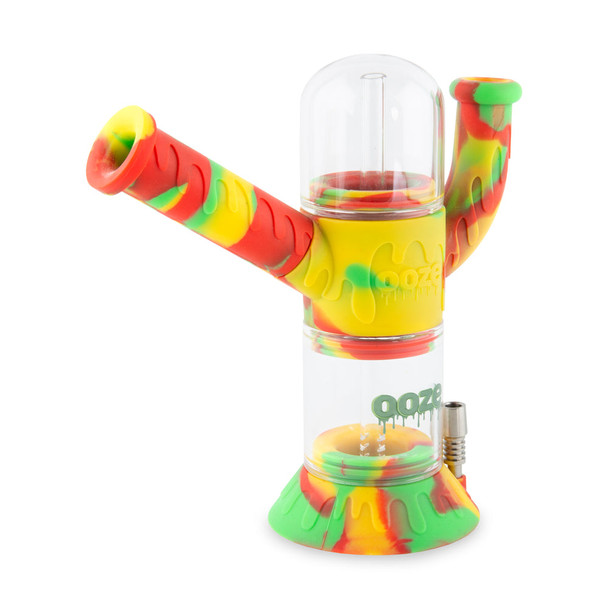 Rasta-colored Ooze hybrid silicone and glass water pipe assembled with clear chamber and titanium accessory mount