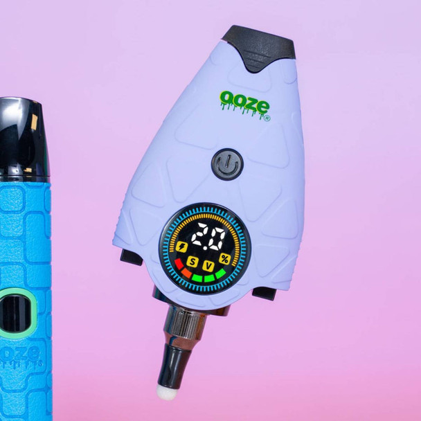 Lavender Ooze Hover concentrate vaporizer with color digital display, ceramic tip, and textured grip shown against a gradient background