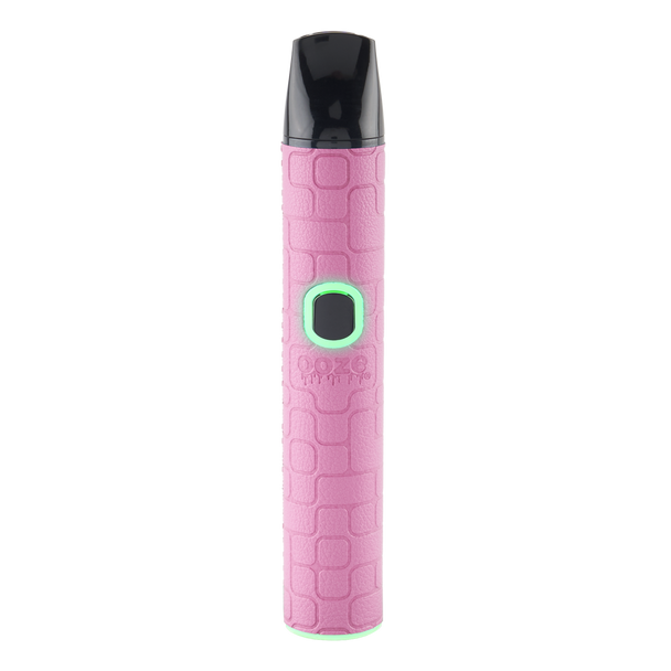 Pink Ooze Pinch dry herb vaporizer with textured exterior, black mouthpiece, and glowing control button