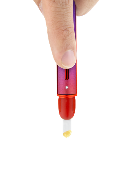 Hand holding Puffco Plasma Hot Knife downward with ceramic tip and small concentrate amount visible