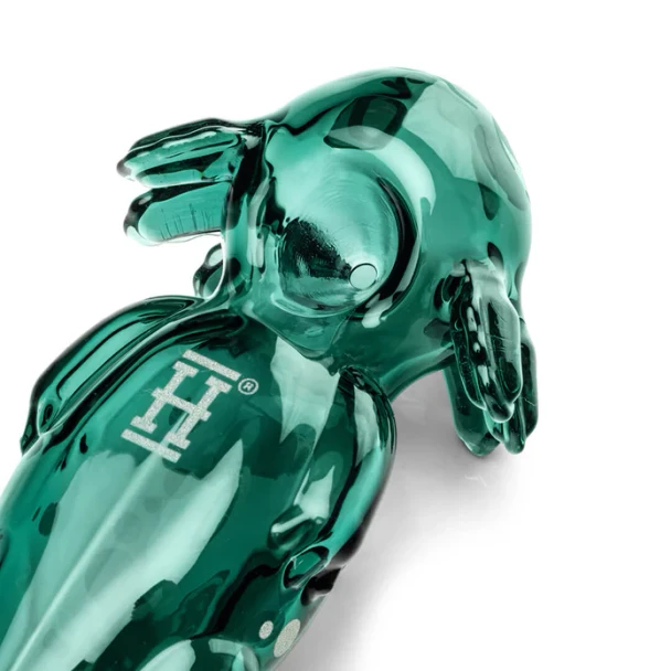 Hemper axolotl glass hand pipe showing its sculpted green body and character-shaped novelty design