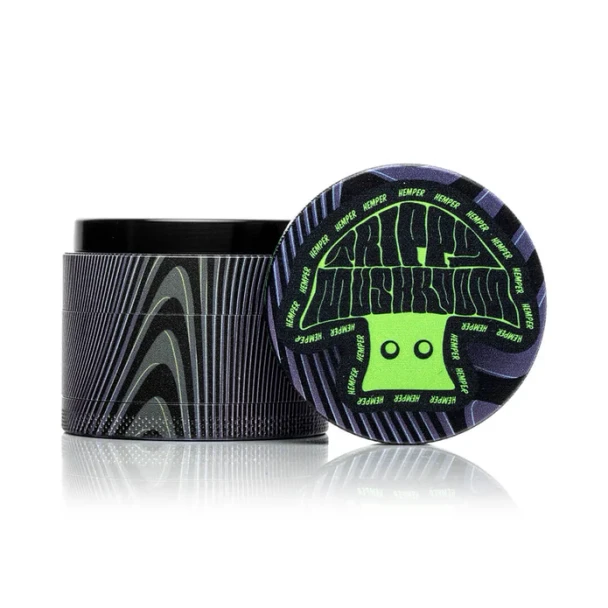 Closed Hemper Trippy Shroom metal grinder showing colorful mushroom artwork against white