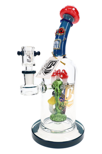 10-inch 6B Glass mushroom monster water pipe featuring a blue silver fumed character neck, mushroom showerhead perc, 14.5 mm female joint, quartz banger, and branded hang tag.