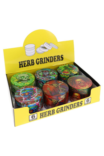 Six colorful decal design grinders arranged in yellow Herb Grinders display box for retail counter merchandising