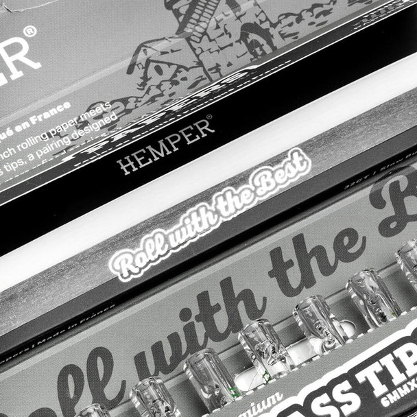 Close-up of open HEMPER Classic White combo pack with rolling papers and clear glass tips visible