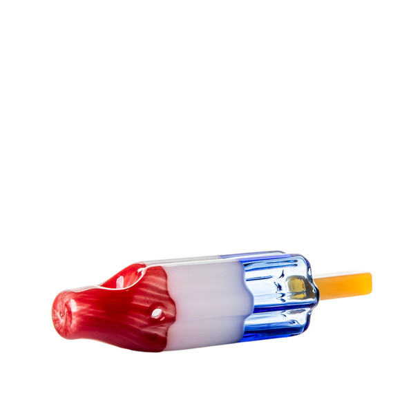 Side angle of popsicle glass hand pipe with red top, white center, blue base and extended yellow stick