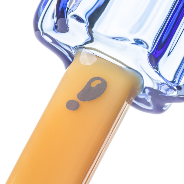 Close-up of yellow glass stick on popsicle hand pipe showing gray question mark decoration near blue base