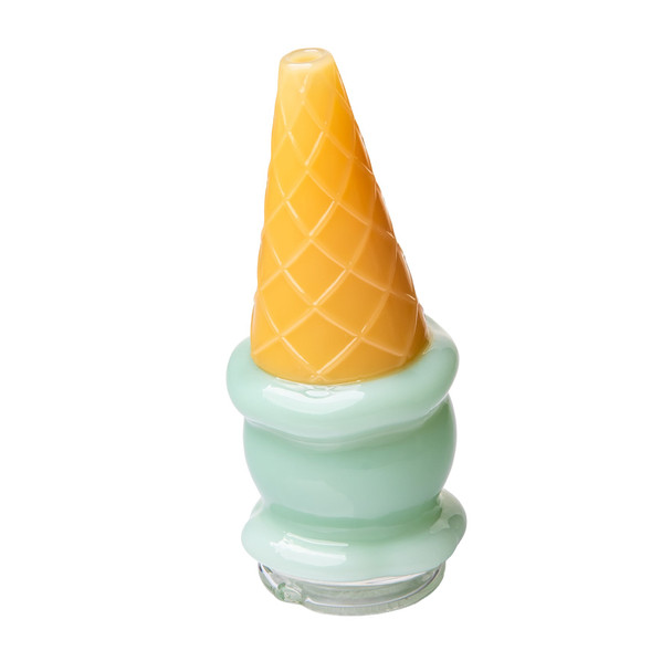 Angled view of ice cream cone Peak top with glossy mint-green body and textured golden waffle cone