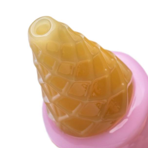 Close-up of golden waffle-textured cone and top opening on the pink ice cream cone Pivot top