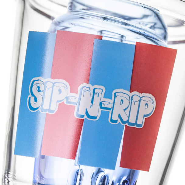 Close-up of red-and-blue SIP-N-RIP graphic on the clear Sip-N-Dip Peak top with blue glass behind it