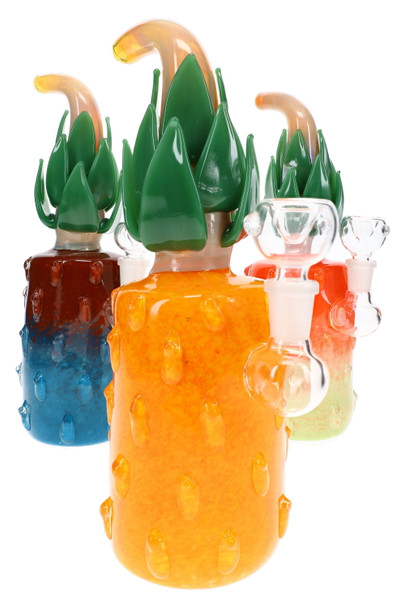 Assorted pineapple glass water pipes with colorful frit bodies, green glass leaves, curved stems, and clear bowls