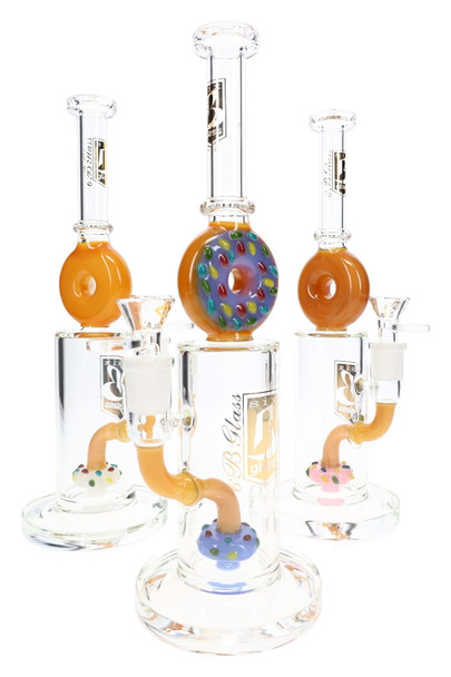 Three 10.5" 6B Glass straight-shooter water pipes with donut necks, sprinkled donut percs, and varied accent colors