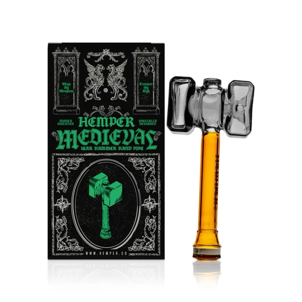 Hemper Medieval Warhammer glass hand pipe beside black Medieval-themed retail box with green artwork