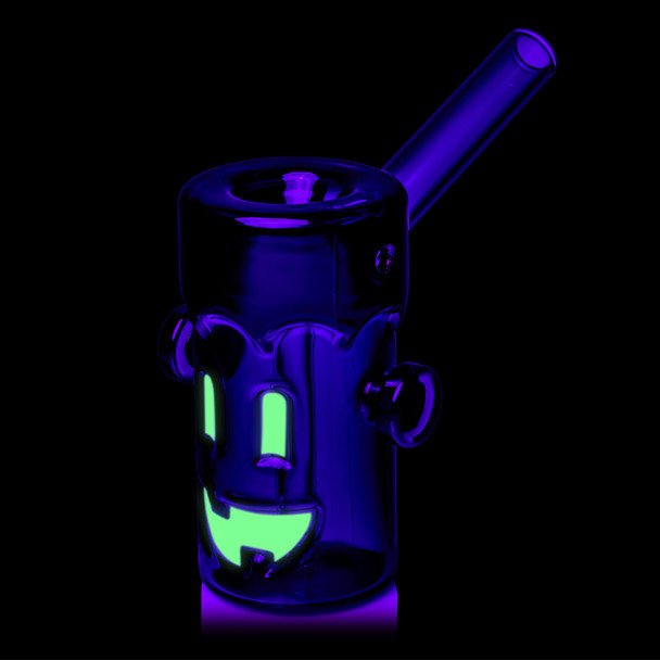 Three-quarter UV view of MJ Arsenal Frankenbubbler highlighting the glowing green monster face and side bolts