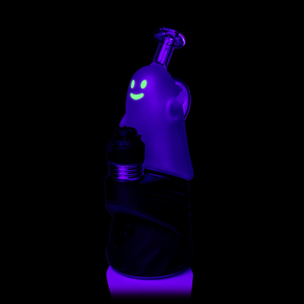 Angled UV view of MJ Arsenal Specter Peak Top on a black Peak device with glowing green ghost face