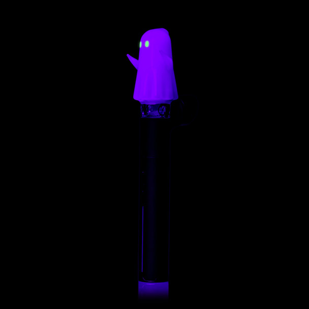 Angled UV view of MJ Arsenal Specter Pivot Top on a Puffco Pivot showing purple ghost body and green glowing eyes