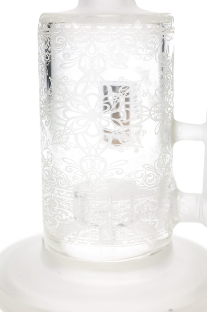 Close-up of frosted lotus artwork on the clear 6B Glass water pipe body, highlighting decorative head-shop glass detail.