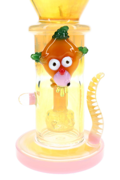Close-up of 10.5" 6B Glass fumed water pipe with orange character accent and spiral spike for head-shop displays.