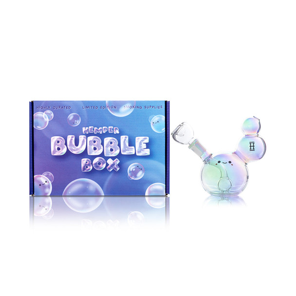 Hemper Bubble water pipe with iridescent finish and clear bowl beside a blue Bubble Box package.