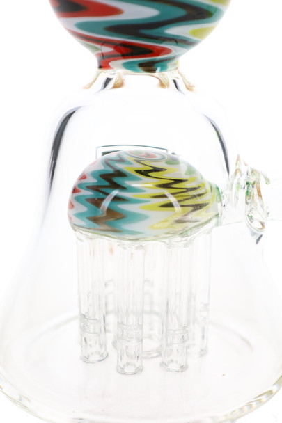 Close-up of the eight-arm reverse tree perc with multicolor zigzag accents inside the clear dab rig chamber.