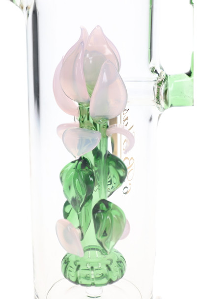 Close-up of the pink glass rose, sculpted green leaves, and showerhead perc inside the clear chamber.