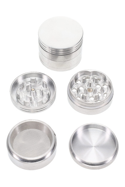 Raw-silver 1.75" 4-part aluminum metal grinder disassembled—magnetic lid, CNC teeth, mesh screen, kief catch; wholesale grinder photo, top-down studio view.