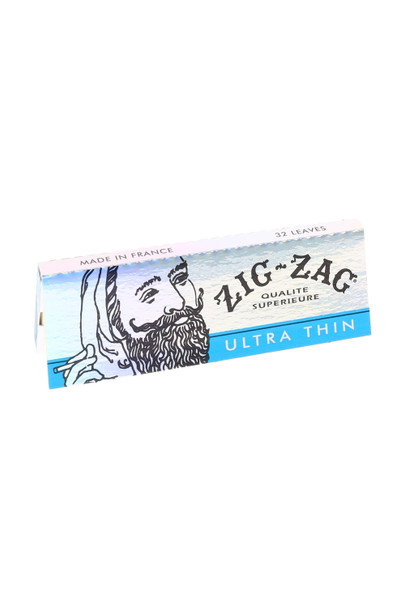 Single Zig-Zag Ultra Thin 1 1/4 pack, blue and white cover with Zig-Zag man, 32 leaves, made in France—stock for head-shop shelves.