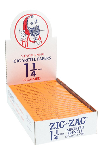 Zig-Zag 1 1/4 paper display for retail smoke gear, white counter box with orange packs at front angle