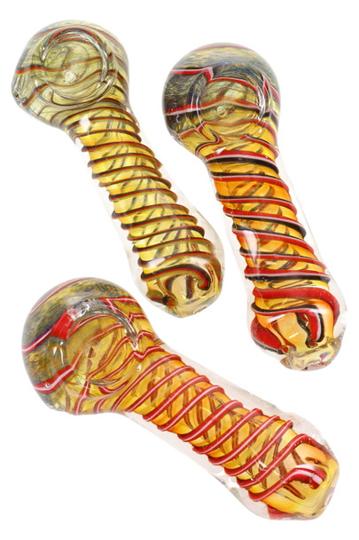 Trio of 4.5" gold-fumed spiral glass spoon pipes, amber tones with red wraps, top-down studio angle for head-shop wholesale catalog listings Trio of 4.5" gold-fumed spiral glass spoon pipes, amber tones with red wraps, top-down studio angle for head-shop wholesale catalog listings