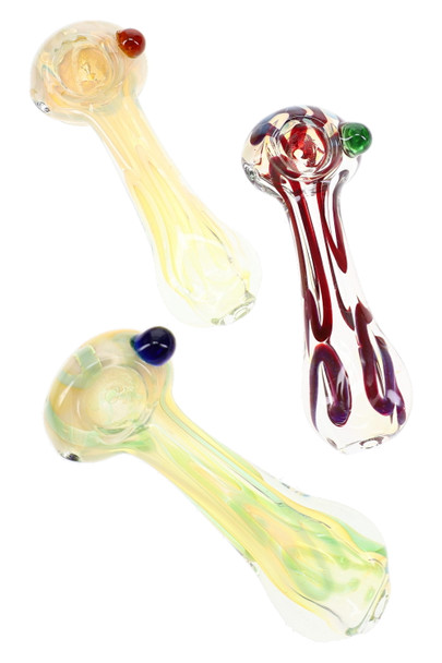 Three assorted glass spoon pipes with yellow, green, red, and blue accents shown together on a white background