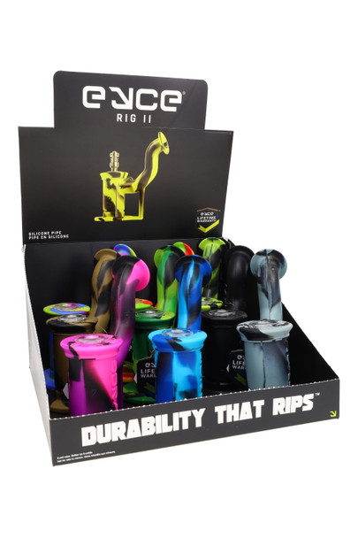 Updated Eyce Rig II counter display showing assorted silicone rigs and lifetime warranty callout, retail smoke-shop presentation, clean white background. Updated Eyce Rig II counter display showing assorted silicone rigs and lifetime warranty callout, retail smoke-shop presentation, clean white background.