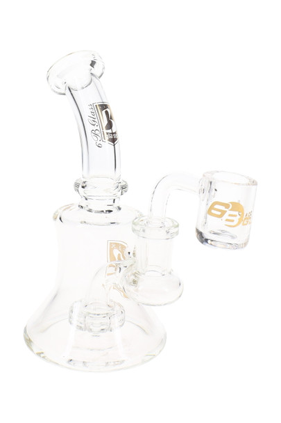 Clear 5.5" wholesale dab rig with stemless beaker body, showerhead perc, and angled quartz banger.
