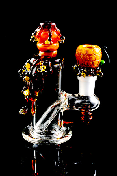 Detailed honeycomb and bee artwork on compact Empire Glassworks nano rig with matching bowl