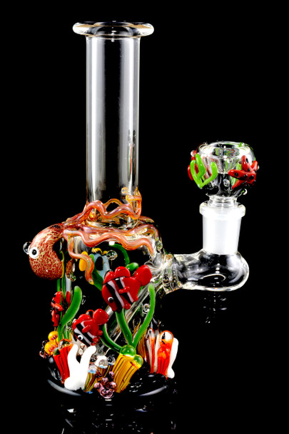 Clear 7" mini beaker rig with octopus wrap, clownfish and coral on black—wholesale dab rig, 14.5 mm female joint, detailed reef accents for showcases.