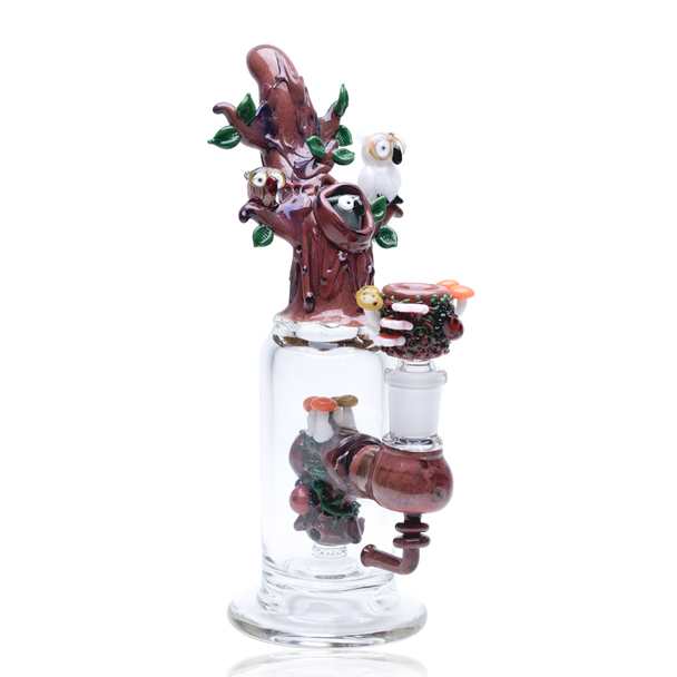 White-background front angle of Hootie’s Tree mini rig showing perched owls, leafy trunk, sculpted cup and bent joint; retail head-shop rig, clear base.