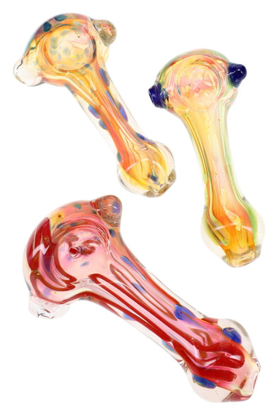 Three gold-fumed glass spoon pipes with orange, pink, and yellow flowing stripes and contrasting dot accents