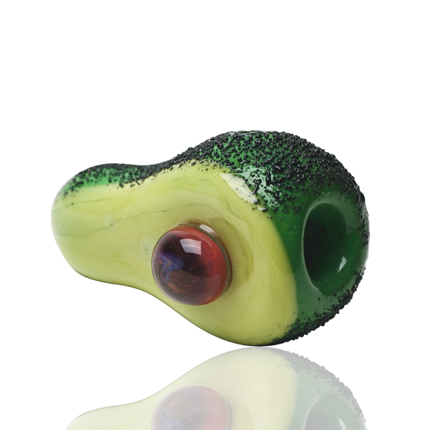 Side profile of avocado-themed glass hand pipe on white, 3" compact size with textured dark-green peel—retail smoke shop wholesale product view.