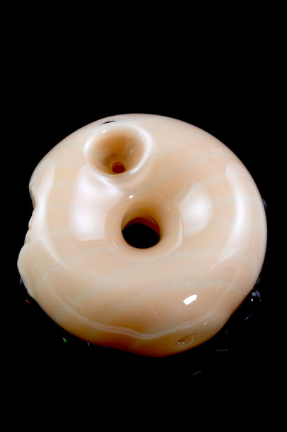 Backside of donut glass spoon highlighting side carb and smooth tan body; 3" US-made hand pipe for head-shop inventory pages.