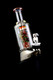 Puffco Peak fitted with Renew the Redwood glass and owl carb cap, studio black; art-glass attachment for wholesale head-shop displays, angled view.